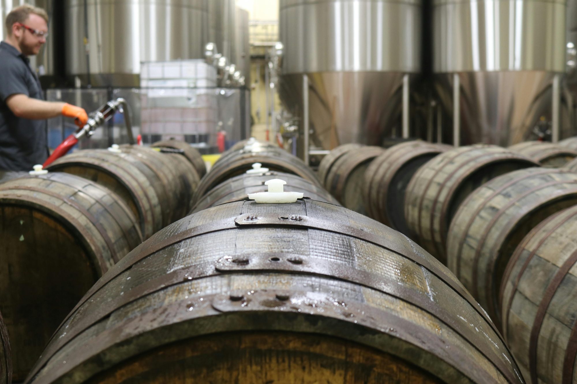 Brewery barrels aging beer with automatic software updates and maintenance