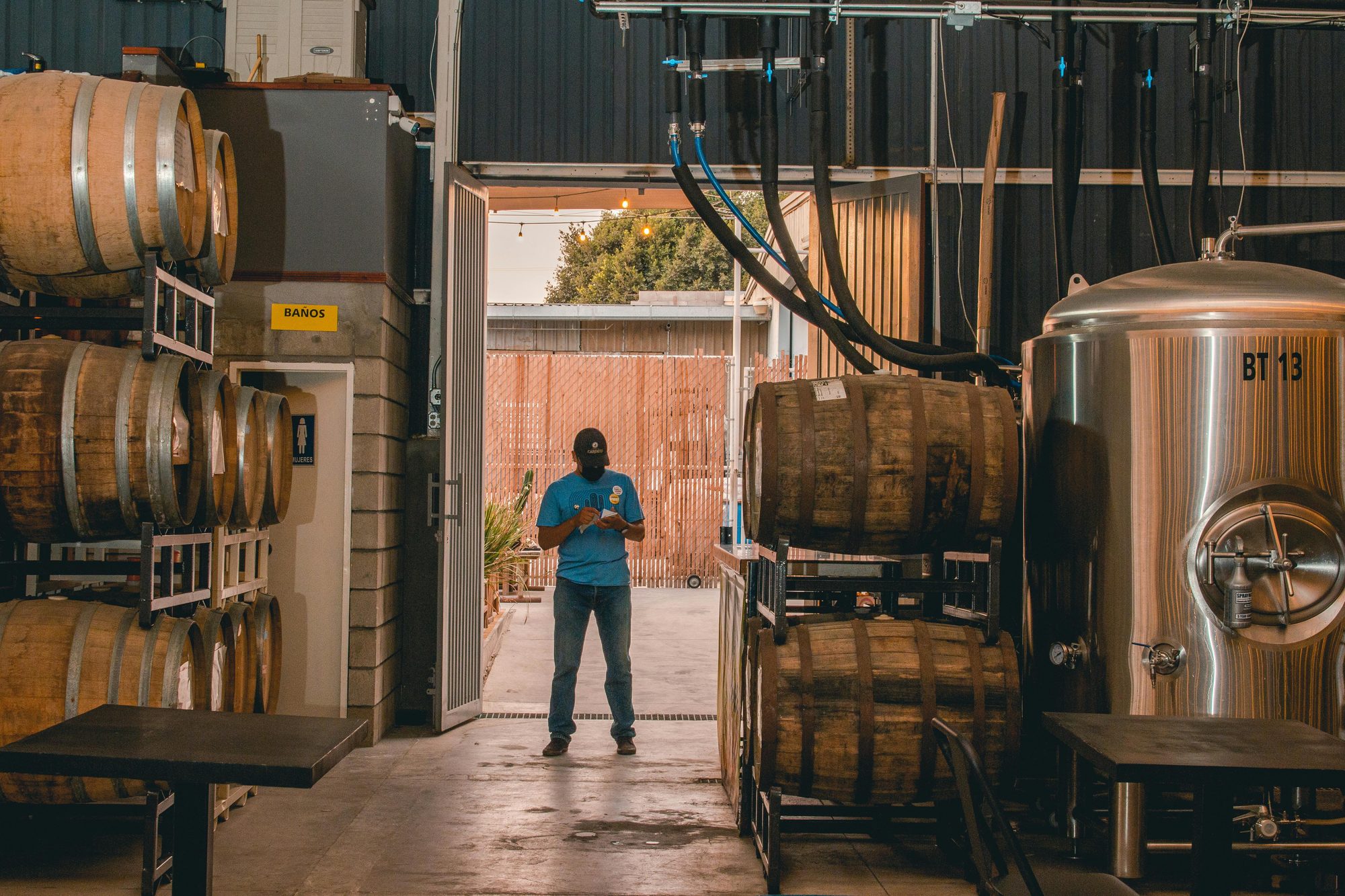 Brewer managing TTB compliance and production records in brewery software